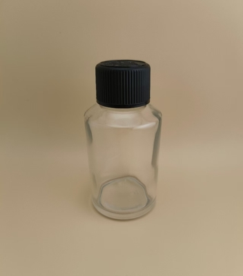 Desain halus Botol kaca bulat halus dengan tutup khusus untuk obat